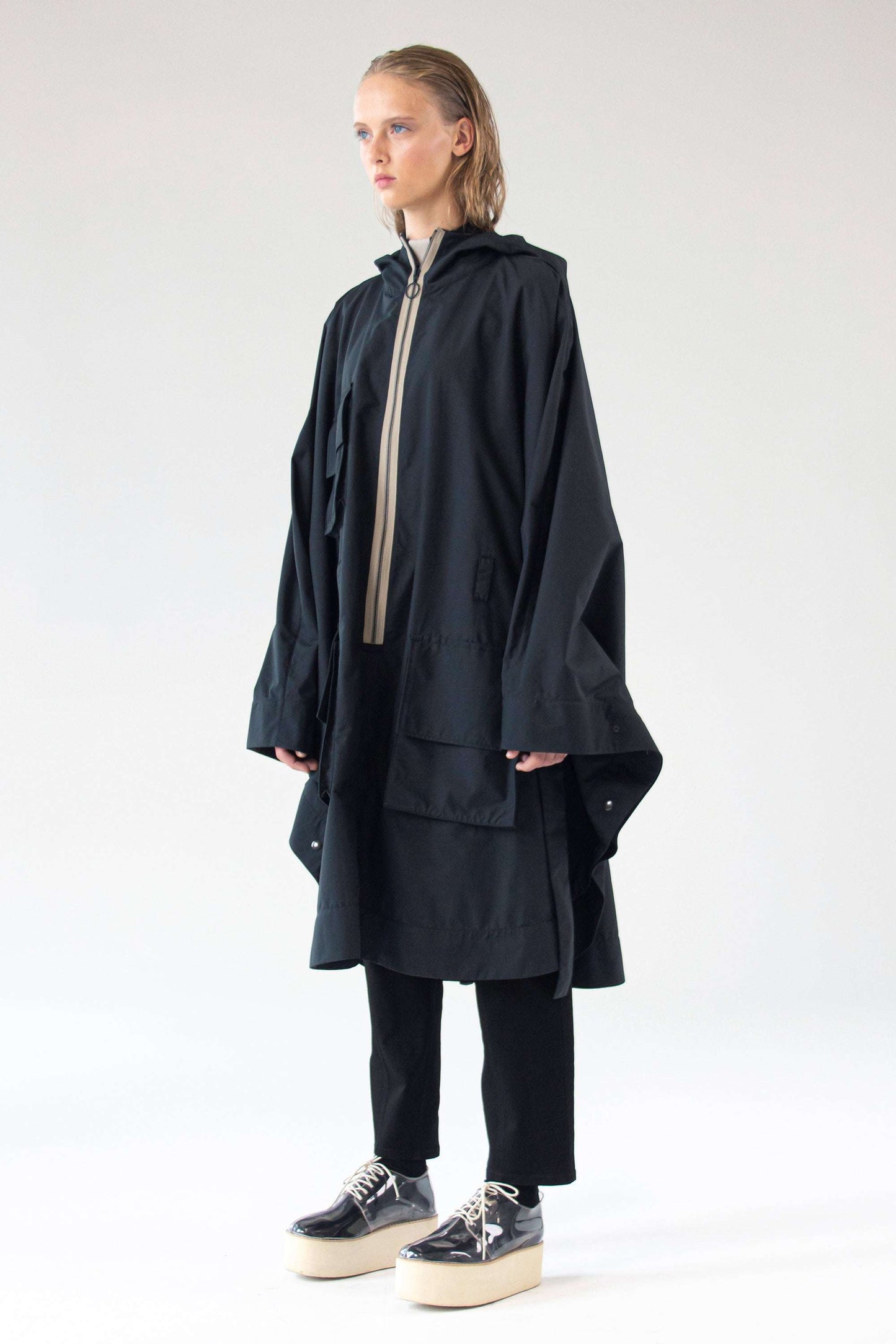 One Wolf Poncho SEEKER front view with contrast zipper and cargo pockets.