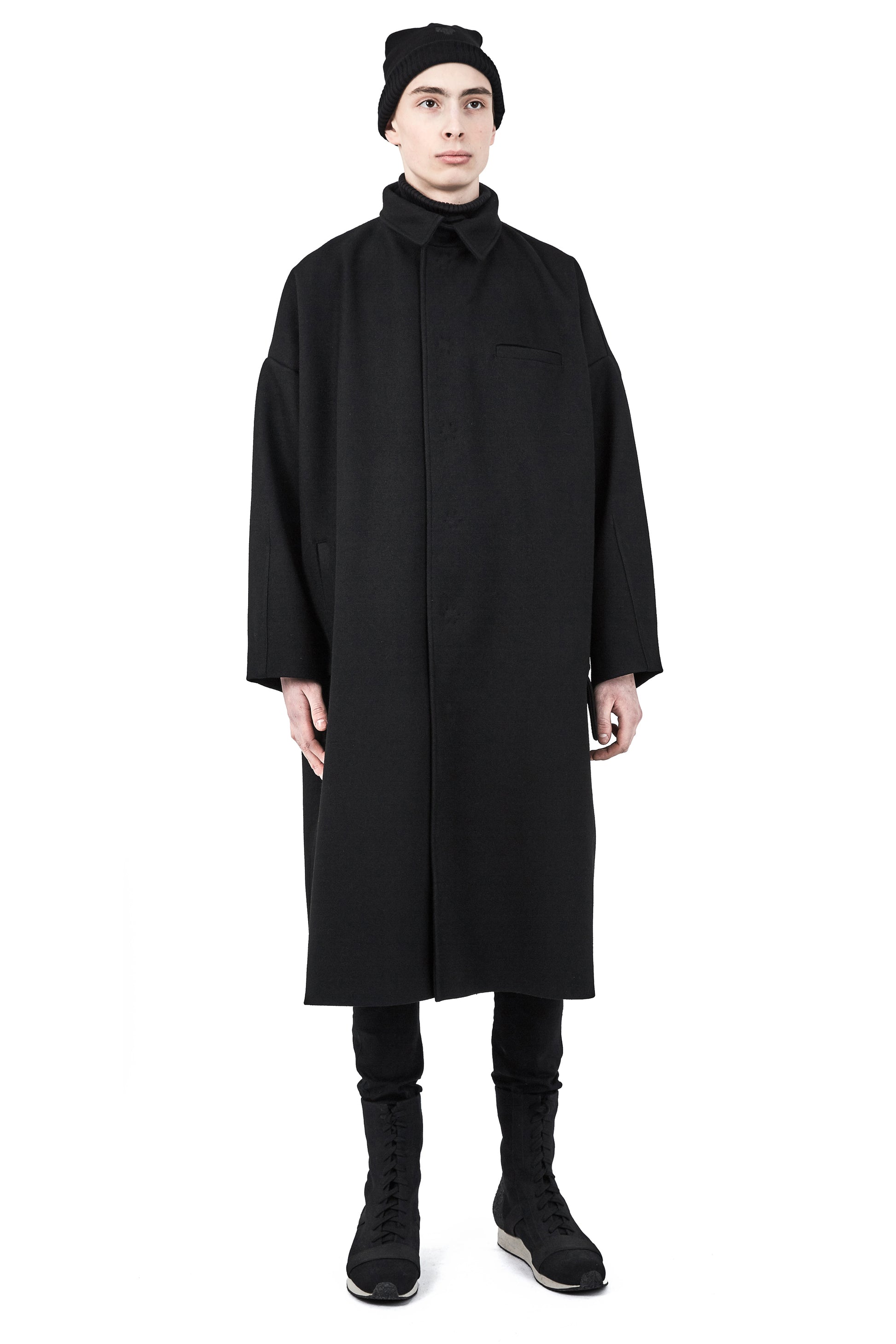 Unisex black wool beanie styled with One Wolf outerwear